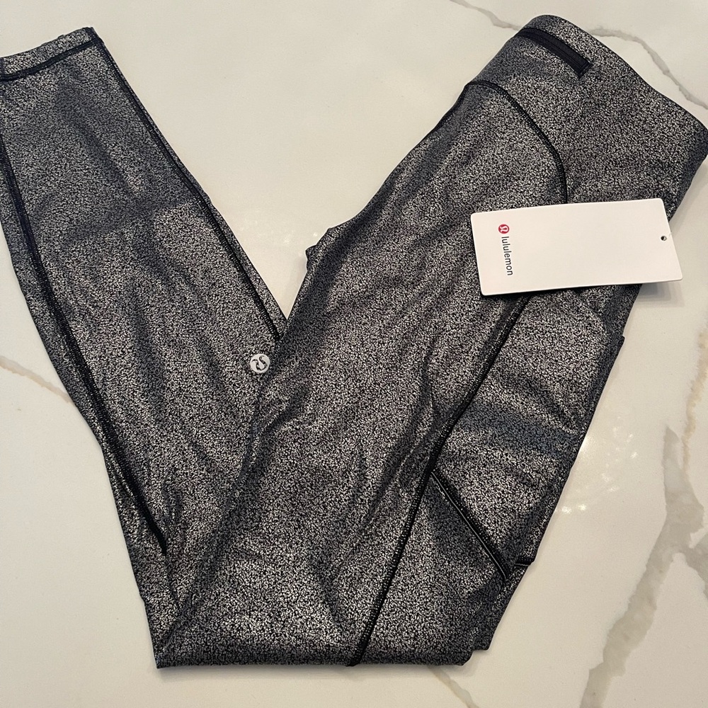 Lululemon brand new speed tight size 4.  28 inch. Side pockets.